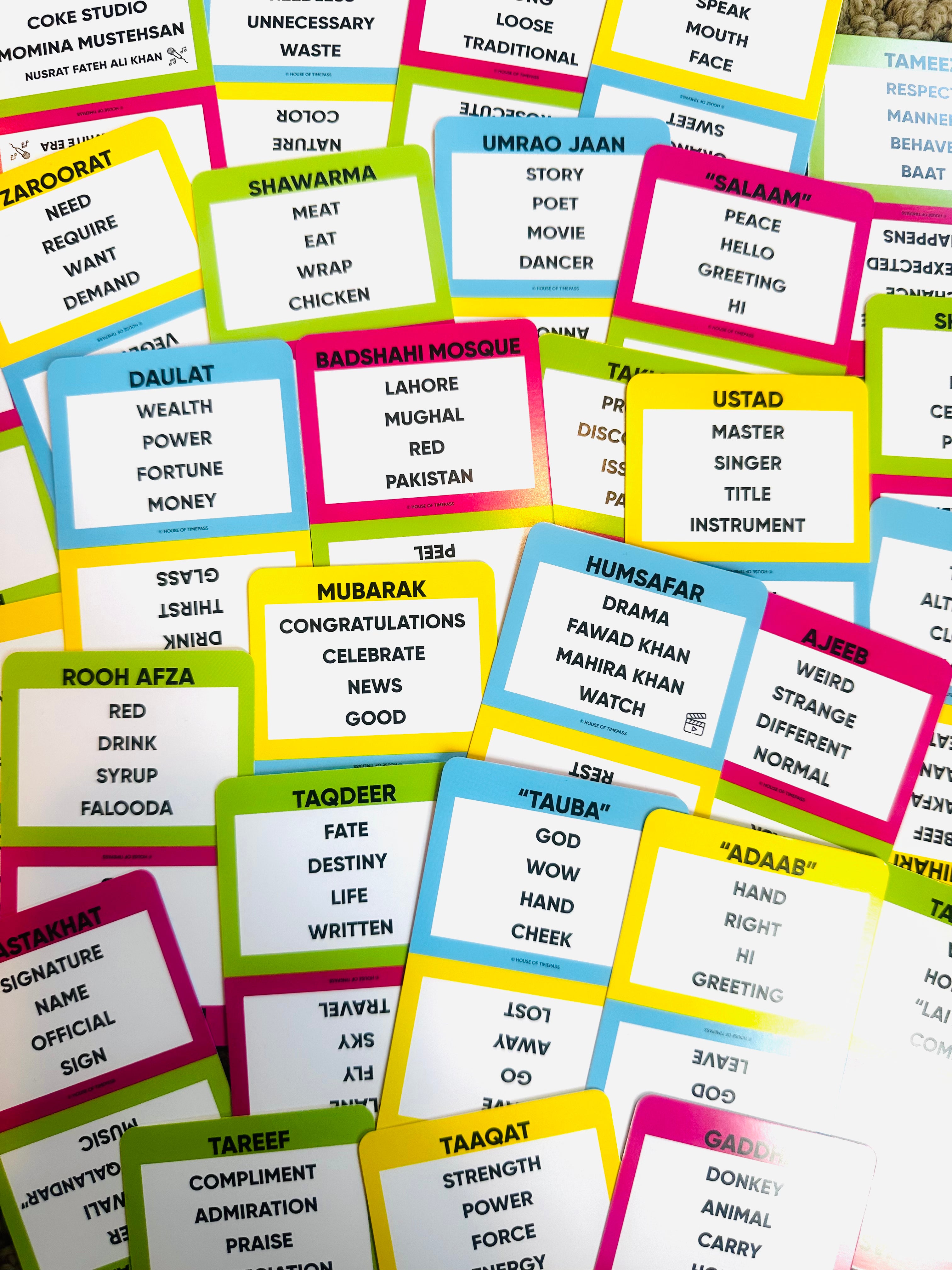 Urdu Pack cards spread out showing Urdu words and phrases to guess