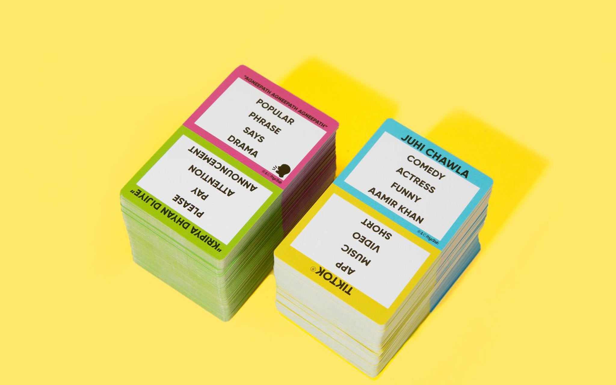 Two stacks of Desi Chaat word cards on a yellow background