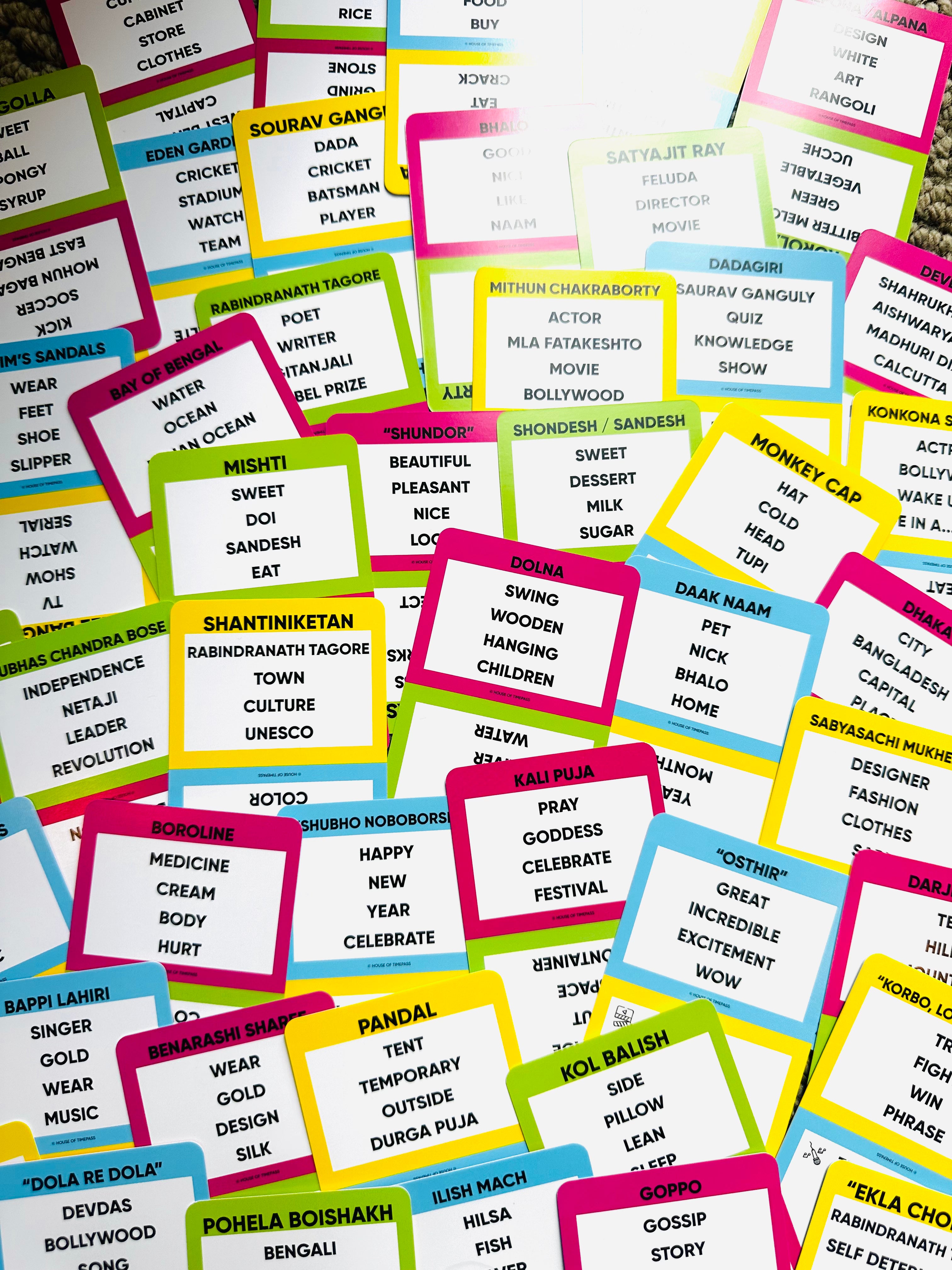 Bengali Pack cards spread out showing Bengali words and phrases to guess
