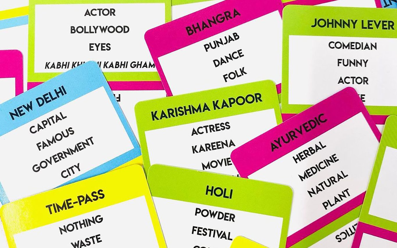 Desi Chaat cards fanned out showing words like Bhangra, Holi, Ayurvedic and Karishma Kapoor